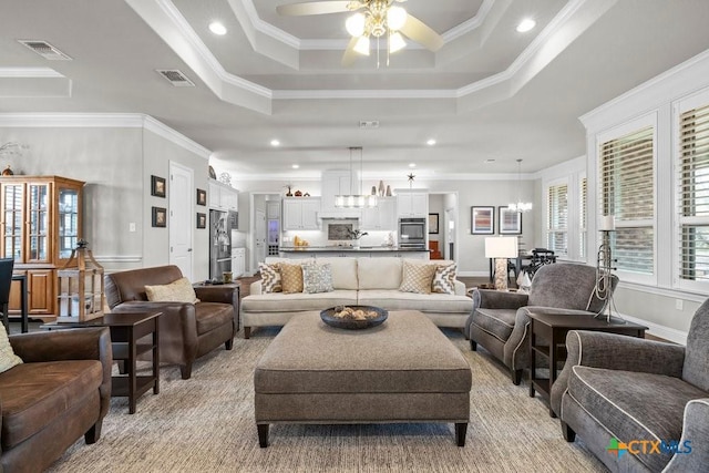 488 Creekside Dr, Belton, TX 76513 - living room with a raised ceiling, ceiling fan, ornamental molding, recessed lighting, and a chandelier