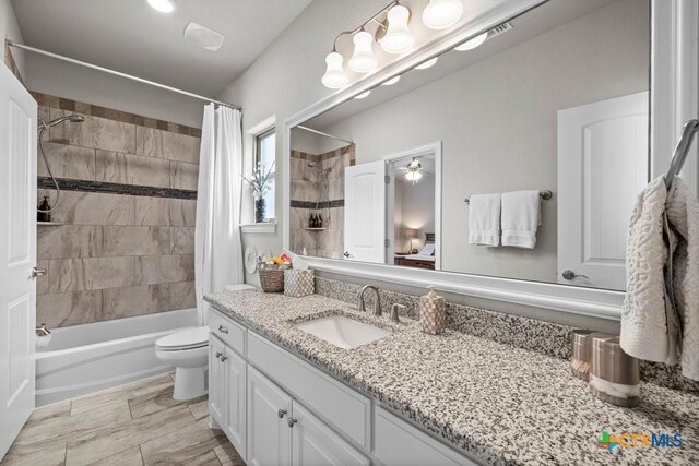 488 Creekside Dr, Belton, TX 76513 - full bathroom featuring shower / bathtub combination with curtain, vanity, and toilet