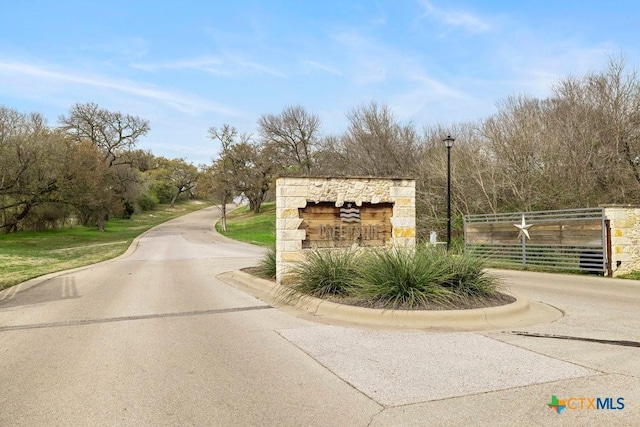 488 Creekside Dr, Belton, TX 76513 - view of asphalt street with curbs and street lights