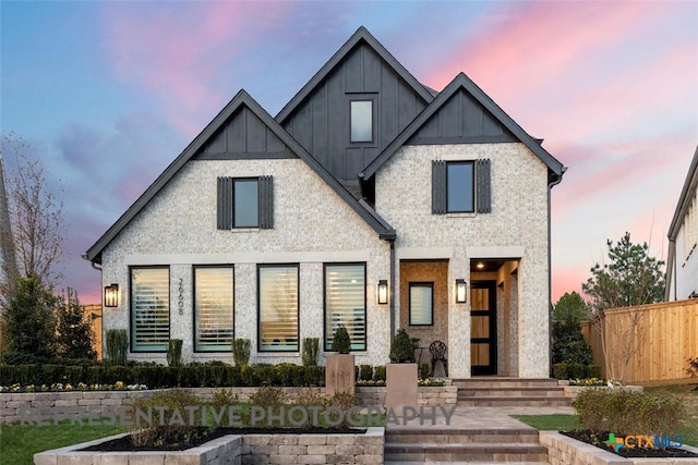 view of front of house featuring fence and board and batten siding