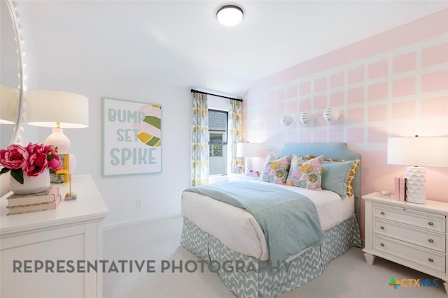 bedroom with carpet floors and baseboards