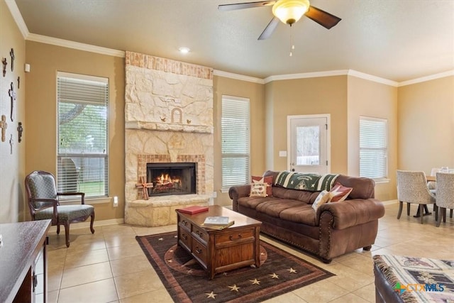 living room with ornamental molding and light tile patterned floors