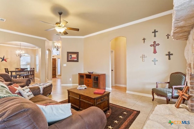 living room with ceiling fan with notable chandelier, light tile patterned floors, and crown molding