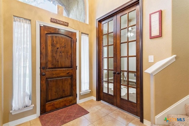 tiled entryway with french doors