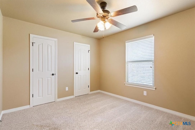 unfurnished bedroom with carpet and ceiling fan