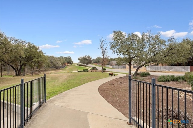 view of property's community featuring a yard