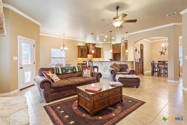 living room featuring ceiling fan with notable chandelier, light tile patterned floors, and crown molding