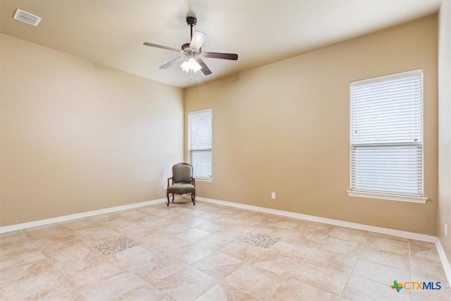 unfurnished room with ceiling fan