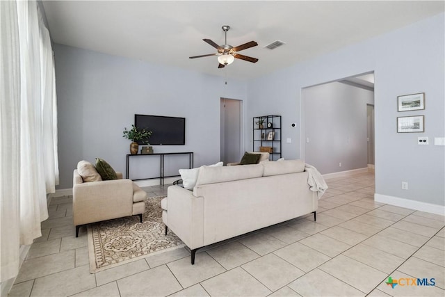 1433 Kamryn Way, New Braunfels, TX 78130 - living area with a ceiling fan, light tile patterned flooring, and baseboards