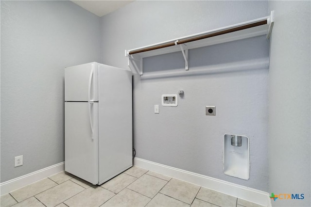1433 Kamryn Way, New Braunfels, TX 78130 - laundry area with electric dryer hookup, washer hookup, hookup for a gas dryer, light tile patterned flooring, and baseboards