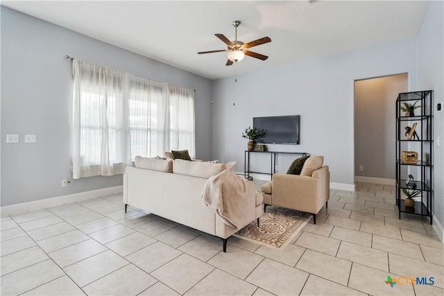 1433 Kamryn Way, New Braunfels, TX 78130 - living area featuring ceiling fan, light tile patterned floors, and baseboards