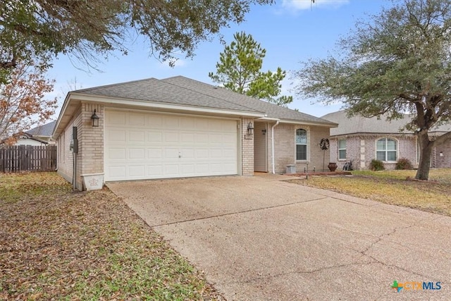 ranch-style house with a garage and a front yard