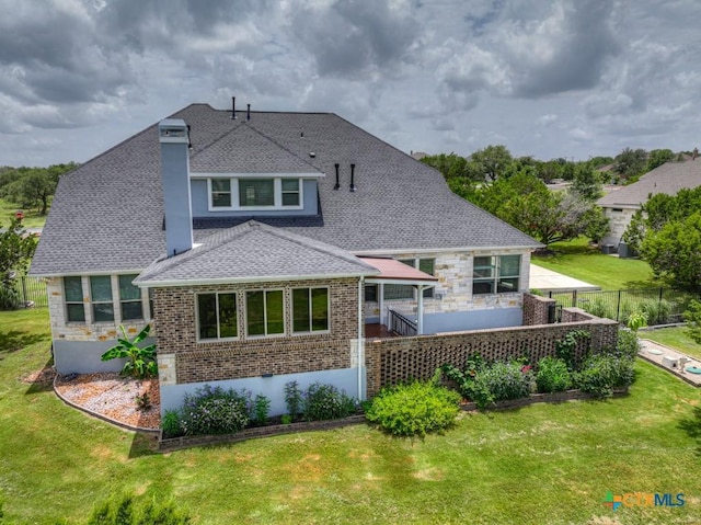 2194 Ranch Loop Dr, New Braunfels, TX 78132 - rear view of house with a shingled roof and brick siding