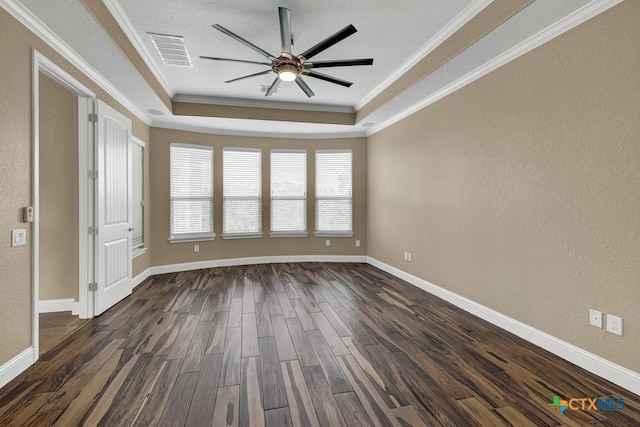 2194 Ranch Loop Dr, New Braunfels, TX 78132 - spare room with a raised ceiling, ceiling fan, dark wood-type flooring, and crown molding