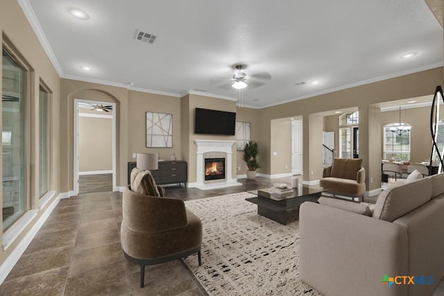 2194 Ranch Loop Dr, New Braunfels, TX 78132 - living room featuring ceiling fan, a lit fireplace, recessed lighting, and crown molding
