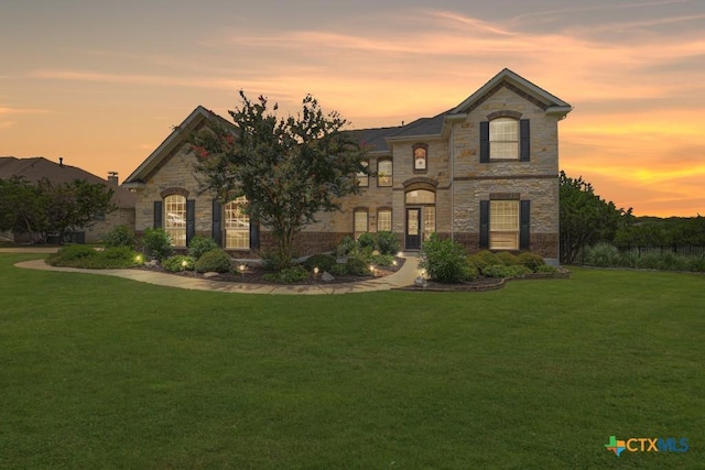 2194 Ranch Loop Dr, New Braunfels, TX 78132 - french country home with stone siding and a lawn