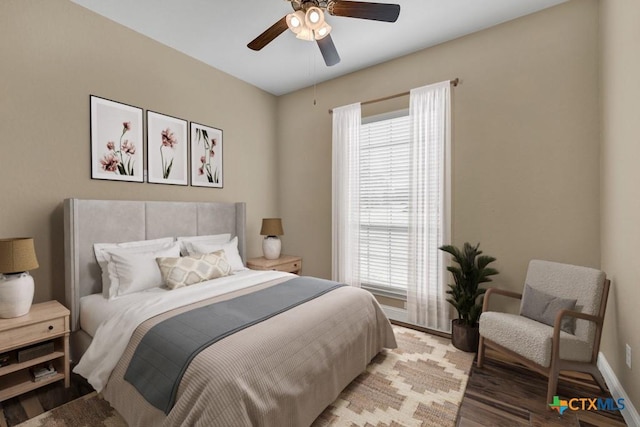 2194 Ranch Loop Dr, New Braunfels, TX 78132 - bedroom with multiple windows, light wood-style flooring, and a ceiling fan