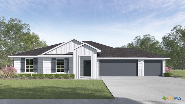 view of front of house featuring a garage and a front lawn