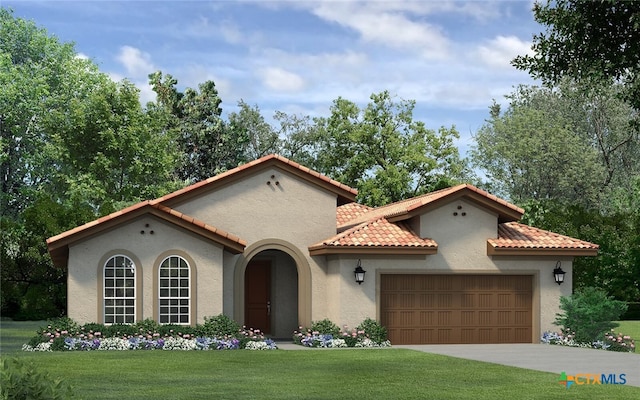 mediterranean / spanish house featuring a front lawn and a garage