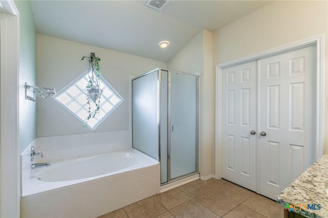 bathroom with a garden tub, visible vents, a stall shower, vanity, and tile patterned floors