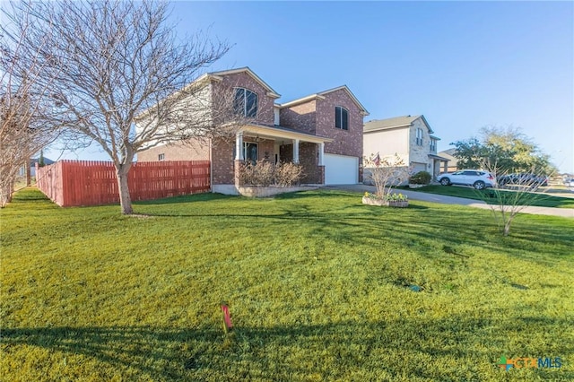 view of side of property with brick siding, a yard, an attached garage, fence, and driveway