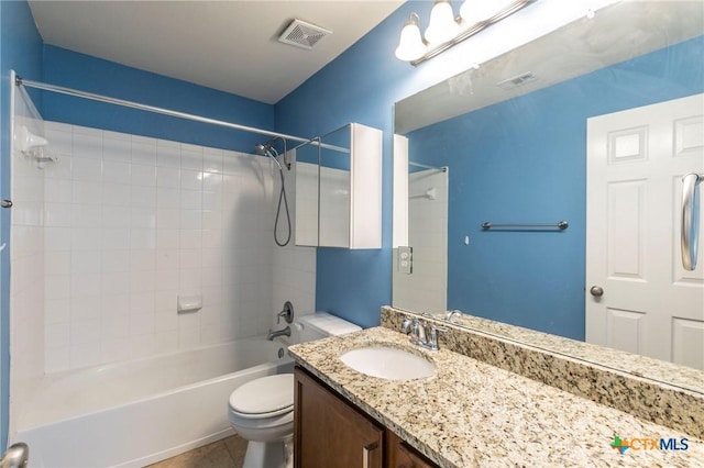 bathroom with visible vents, bathing tub / shower combination, toilet, and vanity