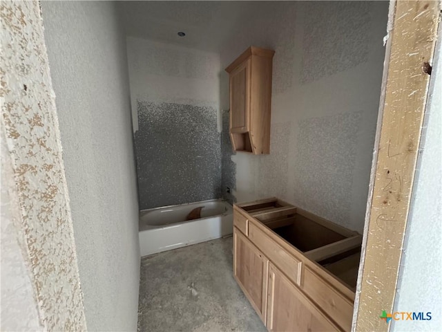 6001 Aquilla Dr, Killeen, TX 76542 - bathroom with concrete floors and a bath