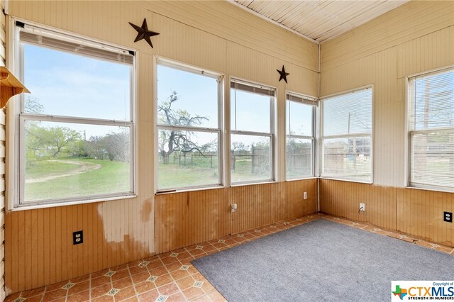 unfurnished sunroom with a wealth of natural light