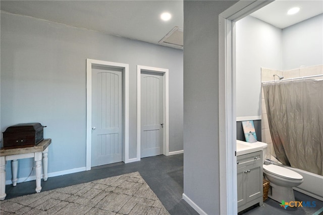 full bathroom with vanity, toilet, and shower / bath combo with shower curtain