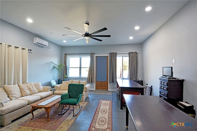 living room featuring hardwood / wood-style floors, a wall mounted air conditioner, and ceiling fan