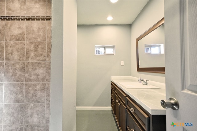 bathroom with vanity and plenty of natural light