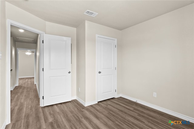 unfurnished bedroom featuring wood-type flooring