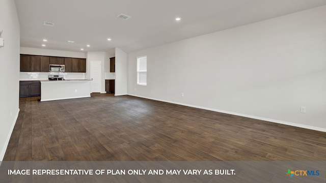 unfurnished living room with dark hardwood / wood-style flooring