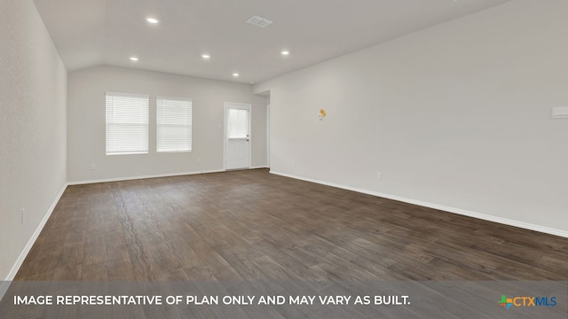 empty room featuring lofted ceiling and dark wood-type flooring