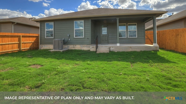 rear view of property featuring central AC and a lawn