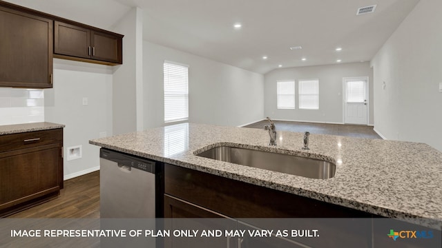 kitchen featuring dark wood-type flooring, sink, light stone counters, dark brown cabinets, and dishwasher