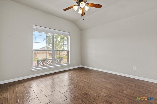 6203 Morganite Dr, Killeen, TX 76542 - empty room featuring a ceiling fan, lofted ceiling, dark wood-style floors, and baseboards