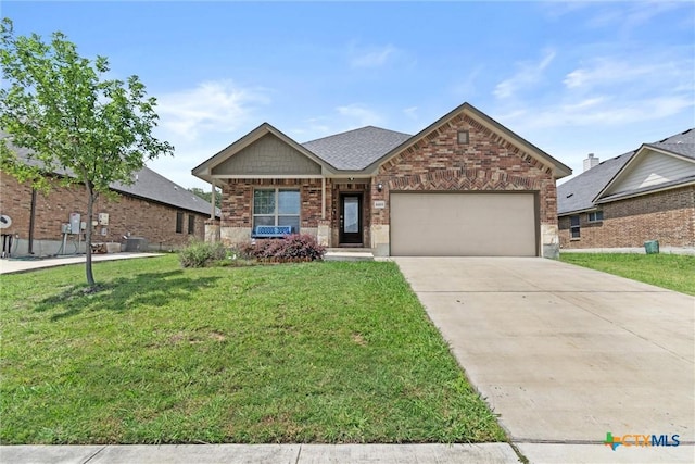 6203 Morganite Dr, Killeen, TX 76542 - view of front of house with brick siding, an attached garage, a front lawn, and driveway