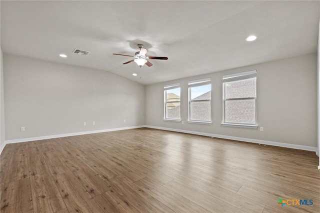 6203 Morganite Dr, Killeen, TX 76542 - spare room featuring ceiling fan, wood finished floors, vaulted ceiling, baseboards, and recessed lighting