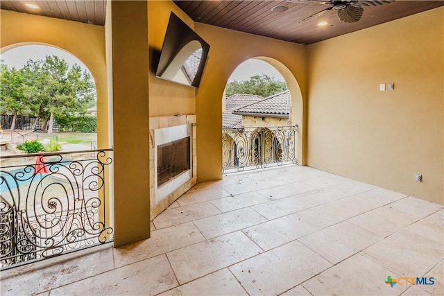 view of patio / terrace featuring a balcony and ceiling fan