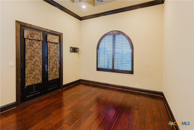 spare room with dark hardwood / wood-style flooring, ornamental molding, and french doors