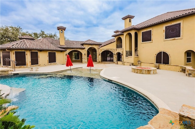 view of swimming pool featuring a patio area