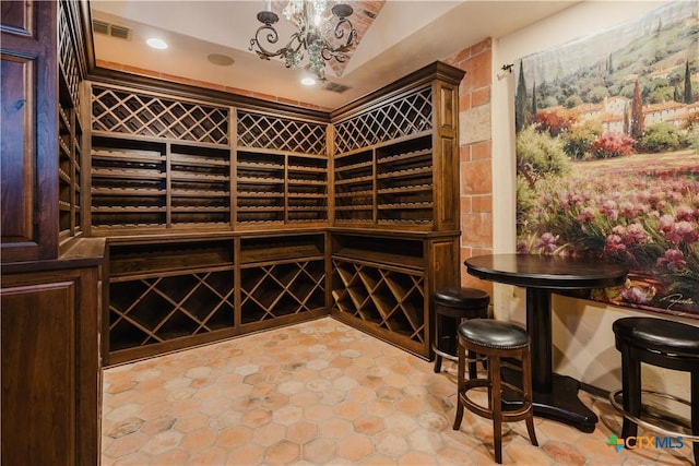 wine room featuring a chandelier