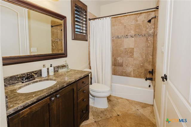 full bathroom featuring vanity, tile patterned floors, toilet, and shower / tub combo with curtain