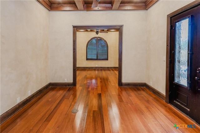 entryway featuring crown molding, coffered ceiling, beam ceiling, and hardwood / wood-style floors