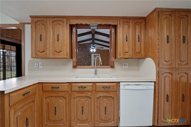 kitchen with white dishwasher, sink, kitchen peninsula, and ceiling fan