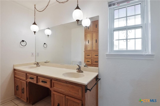 bathroom with a wealth of natural light, vanity, crown molding, and tile patterned flooring