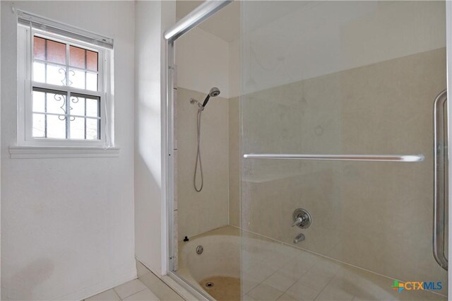 bathroom featuring tub / shower combination and tile patterned floors