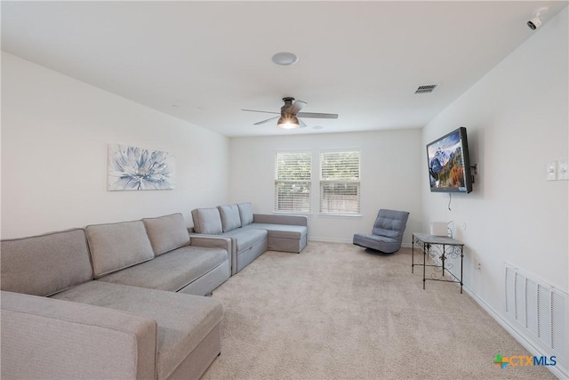 living room featuring ceiling fan and light colored carpet