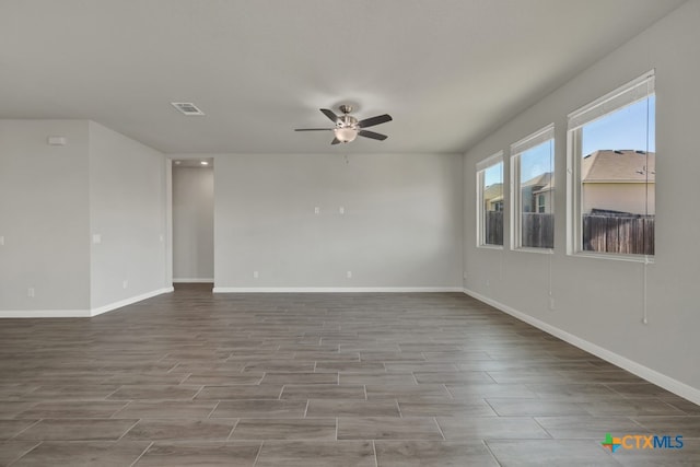 unfurnished room with hardwood / wood-style floors and ceiling fan